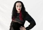 Summer on a plain white background wearing a black silk blouse, a black velvet waist cincher, and a necklace with red roses and thorns #2