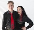 Summer and Roger standing side by side on a plain white background