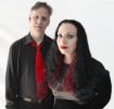 Summer and Roger standing side by side on a plain white background #3
